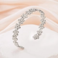Elegant silver stainless steel open bangle featuring an intricate floral pattern design - Floral Pattern / Steel