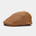 Detail of adjustable metal buckle and woven texture on a brown straw ivy cap - Adjustable / Camel