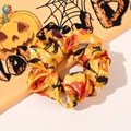 Detailed view of an orange Halloween scrunchie with pumpkin and bat patterns - No. 7 Large Scrunchie / Large Size