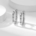 Elegant silver rectangle zircon hoop earrings with polished finish on white pedestal - Large / Silver