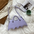 Lavender bat-shaped PU handbag with spider web stitching and cross studs on white fabric - One Size / Violet