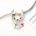 Detail of dragon pendant with clear faceted crystal head and red enamel tail accent - Silver Base White