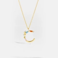 Macro detail of gold letter C pendant with colorful zircon stones on a fine chain - 925 Silver / Letter C