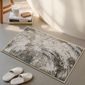 Modern chenille bath mat with grey brown woven pattern in a cozy bathroom setting - Circle Shadow