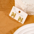 Golden titanium steel letter M stud earrings with polished minimalist finish for women - M