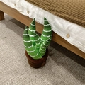Close-up of plush green plant toy with white stripes in a brown fabric pot on cozy rug - Green White Striped Style (Style 1)