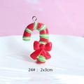 Detailed view of candy cane resin pendant with red bow and metal loop, 2x3cm size - Style 24-Candy Cane with Bow
