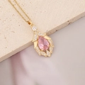 Macro detail of golden necklace featuring a pink pear-shaped stone with micro zircon inlay - Pear-shaped Pink Stone (10#)