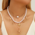 Double-layered golden necklace featuring pearls with starfish and shell charms - Style 09 Necklace