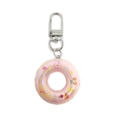 Detail of pink transparent swim ring keychain with cute rabbit and cherry patterns - Light Pink