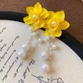 Detail view of yellow flower earrings with cascading pearls and crystals on vintage background - Pearl Tassel Flower Style (21#) / Yellow