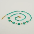 Bohemian gold chain necklace featuring green crystal beads and a flower charm - Green (Necklace)