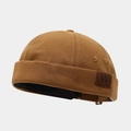 Detail of dark brown canvas miki hat featuring a leather W label and metal eyelets - Adjustable / Letter W Patch Khaki
