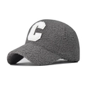 Close-up of the thick grey faux lamb wool texture and white C letter embroidery on cap - Adjustable / Gray