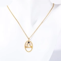 Gold Libra zodiac necklace with small blue gemstone on white display model - Libra