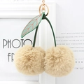 Cute faux rabbit fur cherry keychain with beige fluffy poms and gold metal lobster clasp - Milk Tea