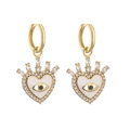 Detailed view of heart-shaped evil eye earrings with gold plating and cubic zirconia - White Enamel Heart