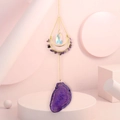 Detail view of purple agate slice and moon shaped crystal suncatcher with golden chains - Purple Crystal