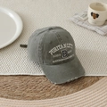 Detailed view of grey washed cotton baseball cap with vintage white embroidery and torn brim - 52-54cm (3-8 Years) / Green