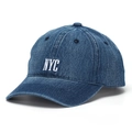 Close-up of NYC white embroidery on dark blue denim baseball cap with refined stitching - Dark Blue