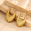 Artistic close-up of gold shell texture earrings on a natural stone base - Shell Texture Style (Style 5)