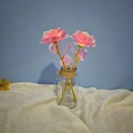 Pink foil artificial roses with golden stems in a rustic glass vase for gift decor - Multi-pink