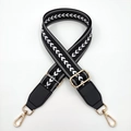 Close-up of black and white geometric woven bag strap with golden metal swivel hooks - Black White Arrow