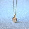 Hexagonal golden stainless steel necklace featuring a white shell inlay and letter T pendant - Letter T