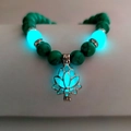 Green turquoise bead bracelet with glowing lotus charm and silver metal spacers - Turquoise Cyan Glow