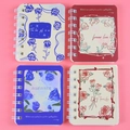 Set of four A7 mini spiral notebooks featuring floral rose designs in blue and pink tones - Blooming Rose