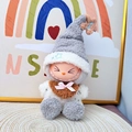 Labubu plush in grey star-patterned hoodie and brown bowtie sitting on a woven mat - Star Hat And Brown Bib Set / First And Second Generation Keychains Are Compatible With La Cloth Dolls. Dolls Not Included.