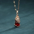 Rose gold PiXiu necklace with red gemstone and crystal inlay on dark teal velvet - Lips Chain / Rose Gold Red Gemstone