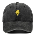 Dark grey washed denim baseball cap featuring a yellow melting smiley face embroidery - Black