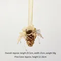 Golden Christmas pine cone hanging ornament with bell and elegant ribbon bow detail - Gold Pinecone A