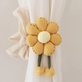 Yellow knitted sunflower curtain tieback with plush balls on a white curtain - Ginger Yellow (Waffle Seven-Petal Flower)