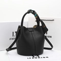 Black pebbled leather bucket bag with decorative printed silk scarf on the top handle - Classic Black
