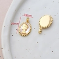 Macro view of 14k gold-filled cameo pendant with shell motif measuring 25mm by 14mm - 14# Oval Queen Cameo Mother of Pearl