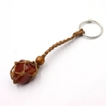 Handwoven mesh keychain featuring a raw carnelian stone with adjustable brown cord - Red Agate + Brown Mesh Keychain