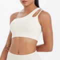 Detail of white one-shoulder sports bra with teardrop cutout and elastic yoga fabric - S / Tops / Light Ivory Style (7114)