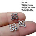 Detail showing a 10x11.5mm silver alloy hollow flower connector on a finger for scale - No.14/Mini Flower
