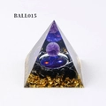 Orgone energy pyramid with amethyst ball, gold foil, and black obsidian on white background - Ball015