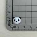 Close-up of a mini 1.5cm panda resin charm on a ruler showing precise small dimensions - Panda Head