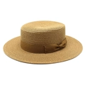 Detail of flat top straw boater hat with fine weaving and dark brown ribbon bow - Khaki