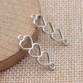 Silver triple heart hollow connectors for DIY jewelry making in a vintage metal style - White Gold