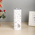 Close-up of a white 20oz stainless steel tumbler with festive Christmas tree patterns - Silver Snowflake and Snowman