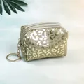 Macro detail of champagne gold leopard print mini pouch with silver zipper and keychain - Gold
