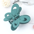 Elegant teal butterfly hair claw clip with matte finish and hollowed-out wing design - Turquoise Green