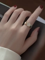 Elegant gold ring with three oval motifs and pavé crystal accents worn on hand - Gold Disc