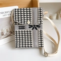 Detailed houndstooth knit bag featuring GRACE lettering and bow design in lifestyle setting - Bow Houndstooth Grey