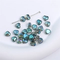 Iridescent teal glass heart beads with a multicolor finish for DIY jewelry making - Heart-6mm-Blue